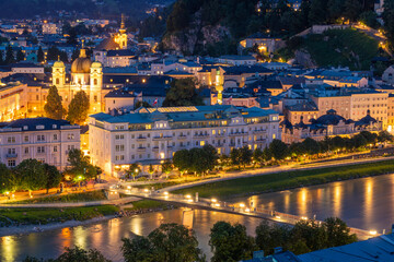 Illuminated Salzburg Old Town at Summer Night. Salzach River. Austria