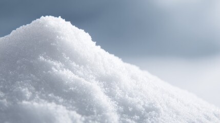 Close-up of Crisp White Snowdrift Against Soft Blue Sky Backdrop, Evoking Winter Scenery