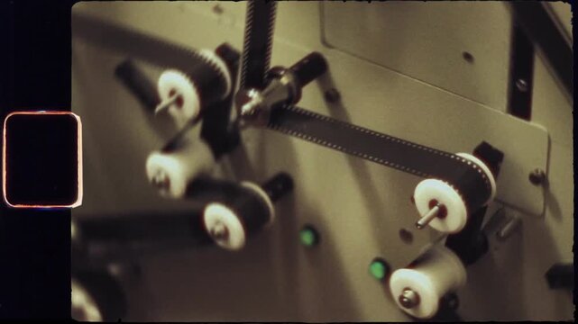 Super 8mm film running through a telecine machine