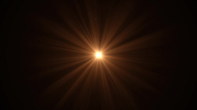 golden dust glitter with sun light on solid colour background. lens streak alpha channel animation and star glitter. lens flare bokeh lights animation for happy new year 2026