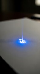 A close-up of a modern laser-etched symbol glowing with blue light on a smooth surface, creating a futuristic and sleek visual effect