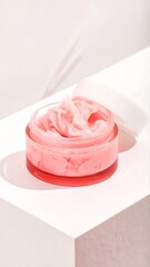 Pink cream jar on a white surface