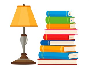 A desk lamp stands beside a tall stack of vibrantly colored books against a white background