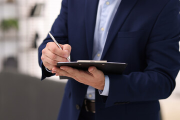 Real estate appraisal. Inspector with clipboard conducting property valuation at home, closeup