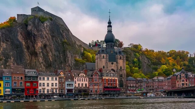 Medieval church and fortress perched on a cliff overlooking a river in the birthplace of the saxophone, Dinant, Belgium, October 13, 2025