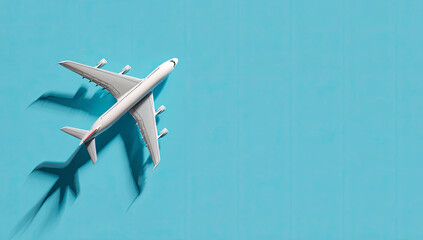 Airplane model on blue background, overhead view