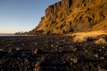 View of Reynisfjara black sand beach at sunset, Iceland
