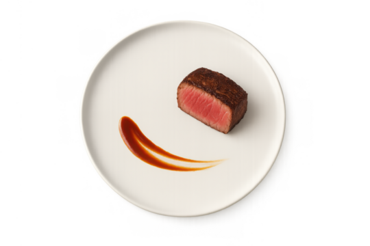 Cooked filet mignon steak with rare center and elegant sauce swirl, prepared gourmet food, transparent background