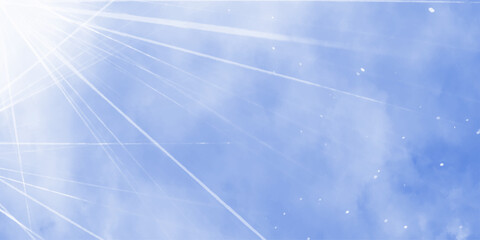 Bright rays of light in blue sky. Winter sun in the blue sky. Blue sky with picturesque fluffy clouds background. Blue sky with fluffy white clouds. Beautiful nature background.