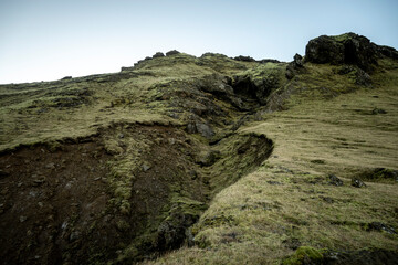 Icelandic landscape with green moss and rocks. Long exposure.