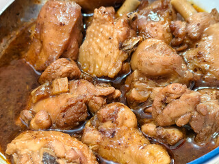 Braised chicken pieces in rich savory sauce