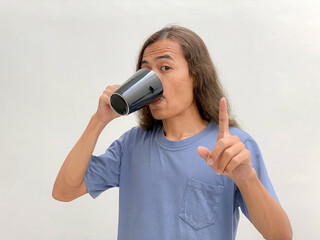 long haired man drinking