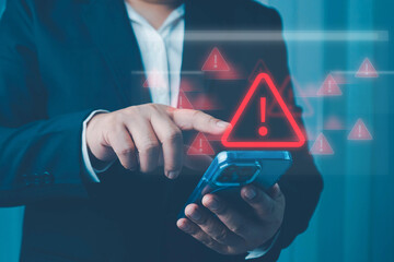 System warning alert on a virtual interface with hand interaction, illustrating cybersecurity risks, data breaches, malware threats, hacking, and digital system vulnerabilities.