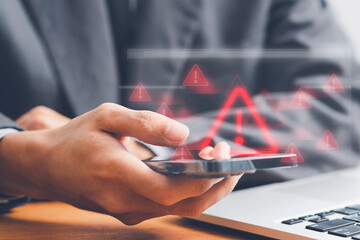 System warning alert on a virtual interface with hand interaction, illustrating cybersecurity risks, data breaches, malware threats, hacking, and digital system vulnerabilities.