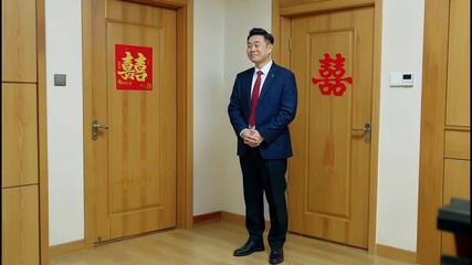 Anxious Asian Groom Experiences a Wave of Emotions on His Wedding Day.