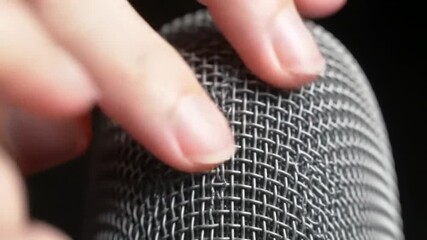 Sound experiment asmr finger tapping on microphone studio setting close-up auditory exploration