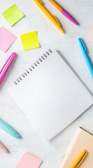 Blank Notebook, Pens, and Sticky Notes:  A Colorful Workspace Ready for Ideas