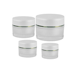  White Cosmetic Cream Jars on Black Background