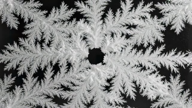 Snowflakes delicately settle on the frosty surface of a windowpane, capturing the essence of a freezing winters day where natures subtlety takes center stage, inviting viewers to pause and.