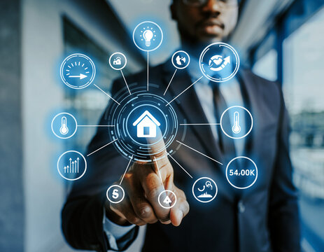 African american man interacting with futuristic smart home interface in a suit indoors