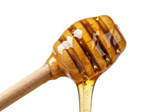 Golden honey dripping from a wooden dipper isolated on transparent background
