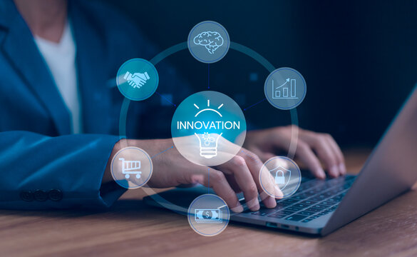 Digital innovation concept driving business growth. Businessman use a laptop with a networking diagram showing ideas, strategy, finance, and security features. Strategic planning for corporate growth