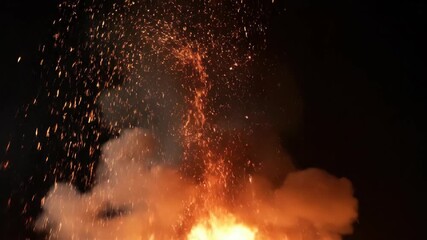 Fiery explosion with sparks on black. - Powered by Adobe