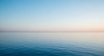Obraz premium Tranquil seascape reflecting a serene sky, offering a sense of peace and natural beauty