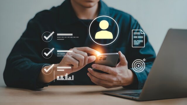 A person interacting with a glowing digital interface showing user profile icons checkmarks documents and progress bars in a modern workspace - Powered by Adobe
