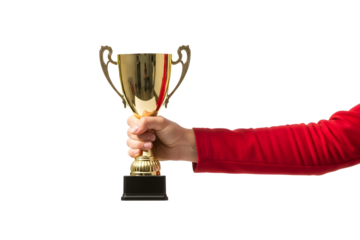 A person's hand in a red sleeve proudly holding a shiny gold trophy cup award for first place victory