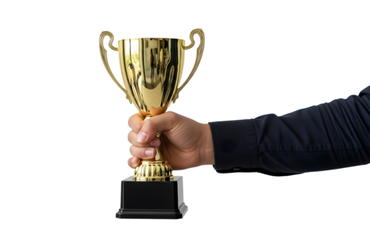 Close-up of a person's hand holding a shiny gold trophy against an isolated white background