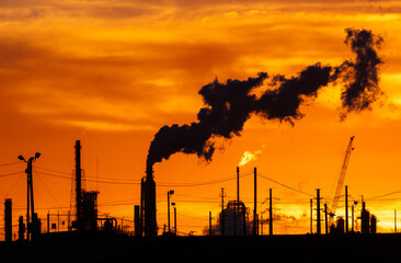 oil refinery petrochemical plant oil gas and energy production with flare stack smoke pollution...