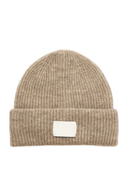 Warm knitted winter cap on a plain white backdrop for woman