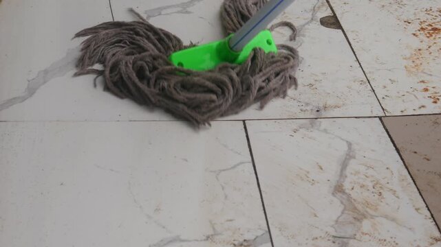 the process of mopping a dirty floor