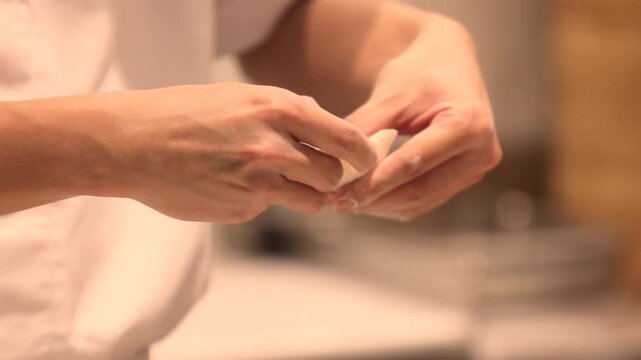 Hands preparing various Asian dumplings including jiaozi shumai har gow tang yuan and fried guo tie showing dough wrapping meat fillings in an authentic culinary process 