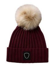 Warm knitted winter cap on a plain white backdrop for woman