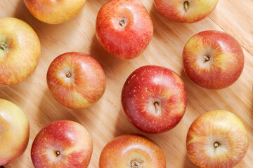 Top view of juicy apples on a wooden table