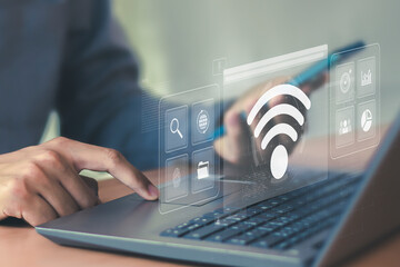 Business using laptop with wifi icon global business communication social network concept