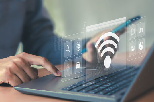 Business using laptop with wifi icon global business communication social network concept	 - Powered by Adobe