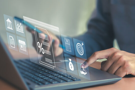 Tax return calculation concept financial research government tax businessman using laptop filling out income tax form online for payment - Powered by Adobe