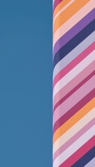 Colorful Diagonal Striped Cylinder Against Blue