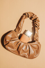 Brown vintage bag and perfume jar top view