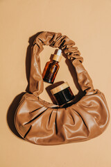 Brown vintage bag and perfume jar top view
