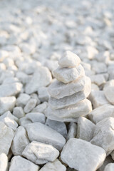 Stack of white decorative stones. Aesthetic tower for balance and zen theme.