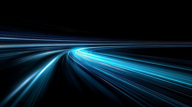 Abstract motion blur of bright blue light trails on a dark road at night creating a sense of speed and movement