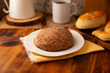 Concha bread. Mexican sweet bread roll with seashell-like appearance, Usually eaten with coffee or hot chocolate at breakfast or as an afternoon snack.