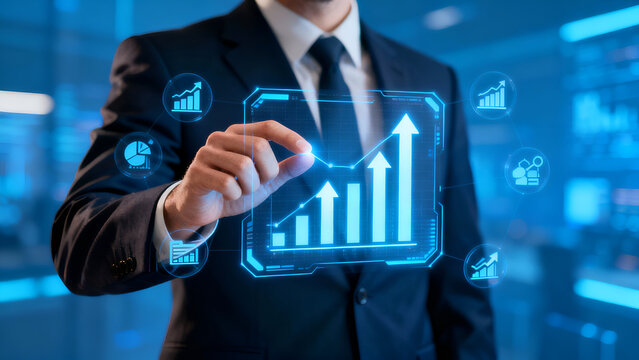 Businessman utilizes a holographic interface to analyze digital growth charts, ideal for finance and technology-related projects.