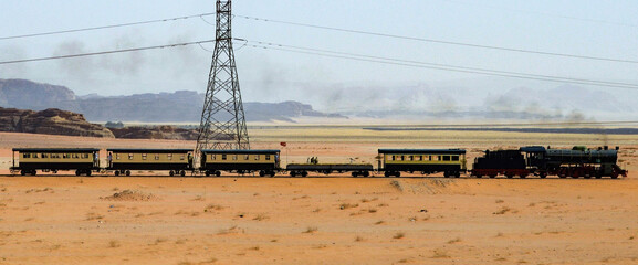 Steam train crossing the Jordanian desert