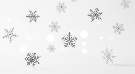Snowflakes falling against a white background.
