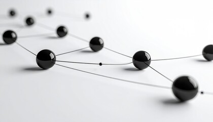 Close-up view depicts glossy black spheres linked by delicate lines against a plain white background, suggesting connections
